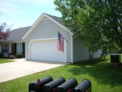Right front view of home has a nice mature tree for some shade.