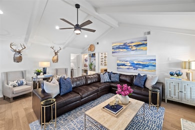 Living area with wood finished floors, ceiling fan, and recessed lighting