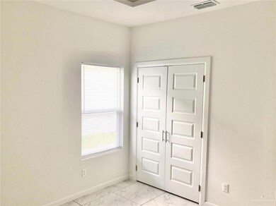 Unfurnished bedroom with light marble finish flooring and a closet