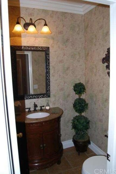 Downstairs powder room with custom paint, crown mo