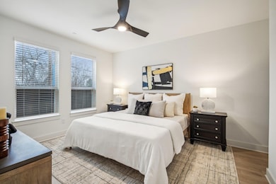 Bedroom with baseboards, a ceiling fan, and light