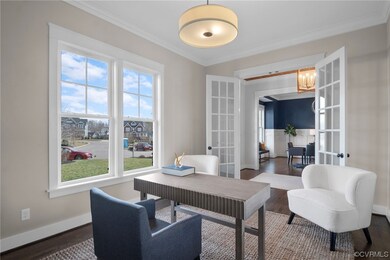 Home office featuring crown molding, french doors,