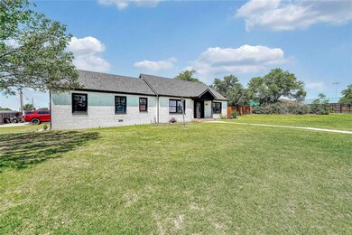 Single story home with a shingled roof and brick s