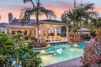 Resort like backyard with covered outdoor bar and 