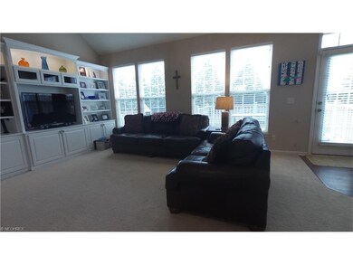 Open living room w/wall of windows