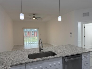 Kitchen featuring stainless steel dishwasher, a si