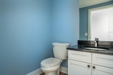 1/2 bath located off kitchen