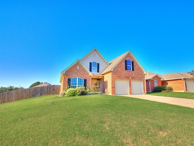 Traditional-style house with brick siding, concrete driveway, and a garage