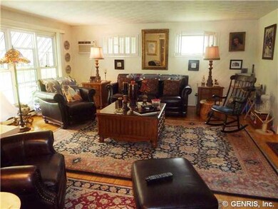 Family Room. Hardwood floors and a wall of windows