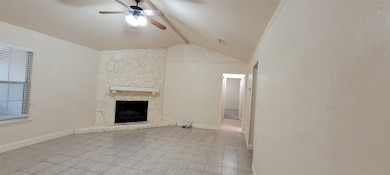 Vaulted ceiling and ceiling fan.