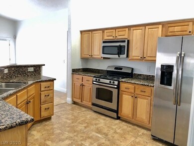Kitchen with all stainless steel appliances includ