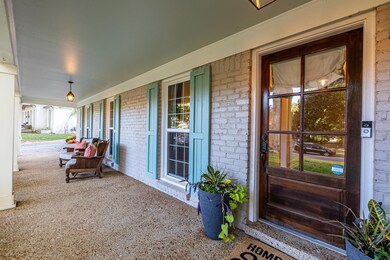 Entrance to property featuring a porch