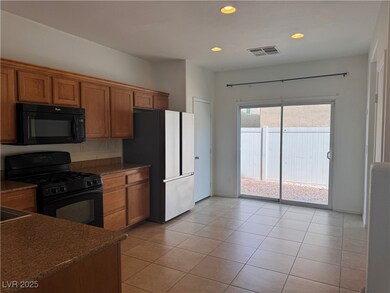 Kitchen with recessed lighting, light tile pattern