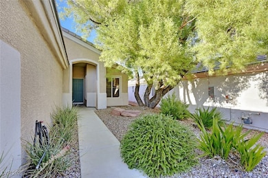 View of exterior entry with stucco siding