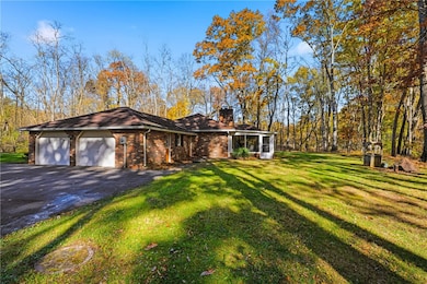 2 car attached grate with man door and large driveway