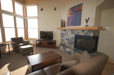 Carpeted living room featuring a fireplace