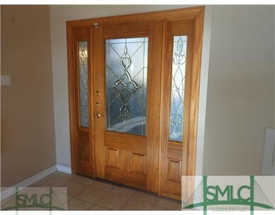 Foyer. Leaded Glass Entry Door with Sidelights.