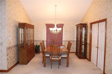 Vaulted Dining Rm. with French doors to Vaulted Be