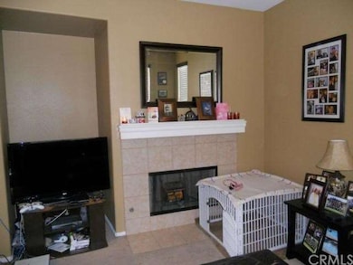 Family room with TV niche and gas fireplace. 