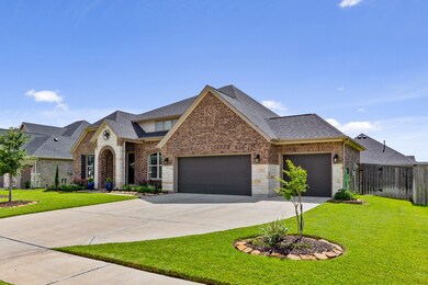 Double-wide to triple-wide driveway, 3 car garage with epoxy floors.