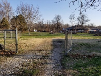 Double gated entry to outbuilding and fully fenced