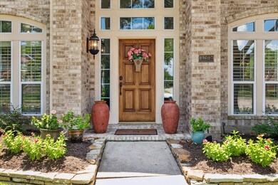Welcoming entrance with beautiful landscaping