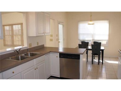 Kitchen. White kitchen with stainless appliances and breakfast area.