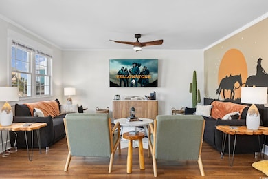 Living room with ceiling fan, wood-type flooring, 