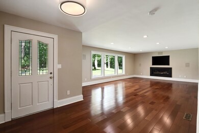 Entrance foyer featuring dark hardwood / wood-styl