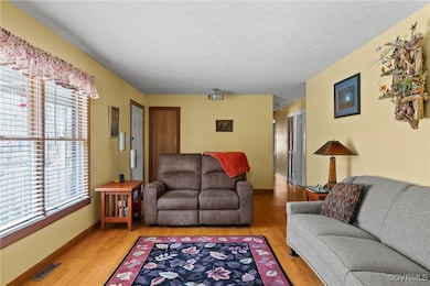 Living area featuring light wood finished floors,