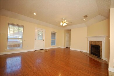 Living Room with Hardwood Flooring & 9 Foot Ceilin