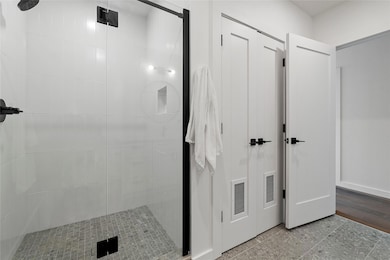Full bath with a shower stall