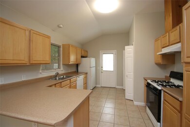 Kitchen with white appliances, under cabinet rang