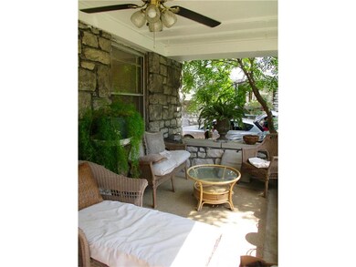 Spacious porch w/ ceiling fan.