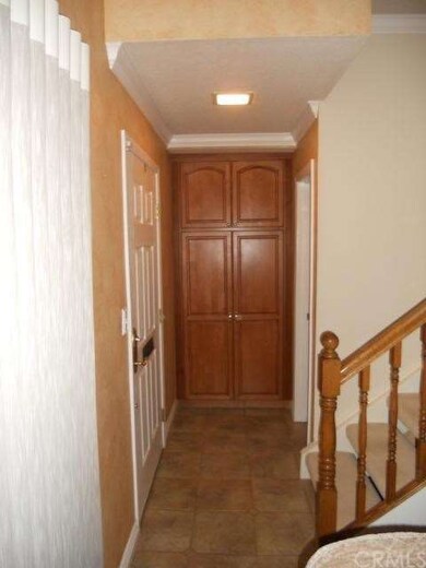 Tile floor just inside front door.