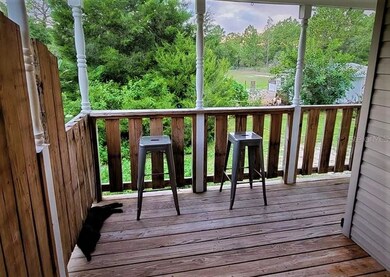 L shaped deck on back of left of house 2