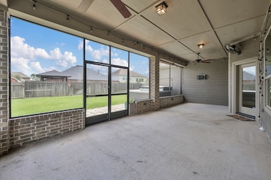 Enjoy the spacious, fully screened back porch with