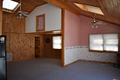 Open concept living room to kitchen/dining areas.