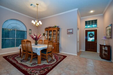 As you enter you are greeted with formal dining. Please excuse the dark windows. It was overcast. Come visit on a sunny day to see the beautiful natural light.