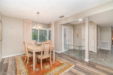 Dining space featuring wood finished floors, a cha