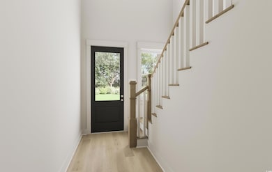 Doorway with light wood-type flooring