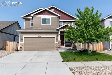 Craftsman inspired home with stone siding, a garage, concrete driveway, board and batten siding, and roof with shingles