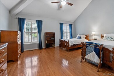 Primary bedroom with cathedral ceiling