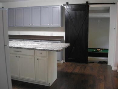 Kitchen with Granite and a Barn Door