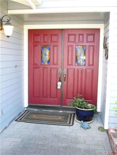 Dramatic doors welcome you to this lovely home