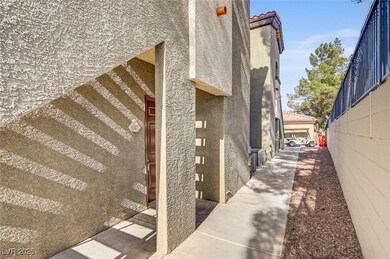 View of home's exterior featuring stucco siding and a tiled roof