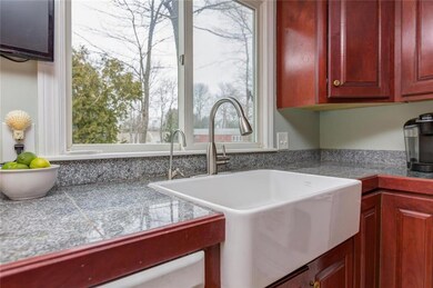 Granite counters and farmhouse sink.