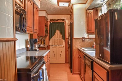 Kitchen has updated cabinets.