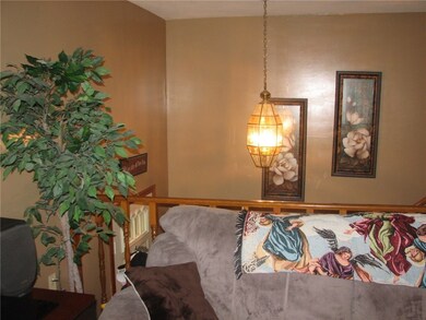 OPEN STAIRCASE OVER LOOKING FOYER