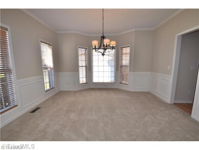 Dining Room. Formal Dining Room features chair rail and boxes for a richer, more formal look.  Great for family meals or entertaining guests!